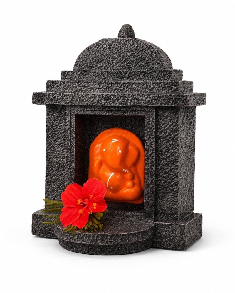Three quarter view of the stone temple against a plain background.