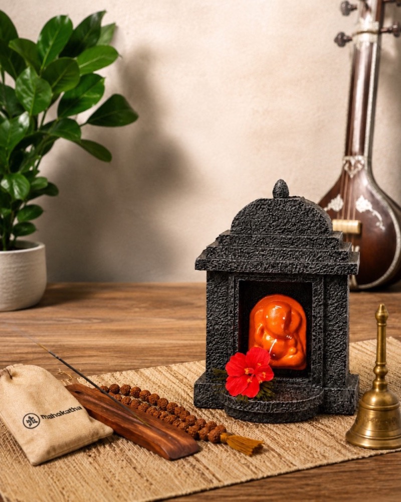 The temple beside its printed cotton potli, incense and beads.